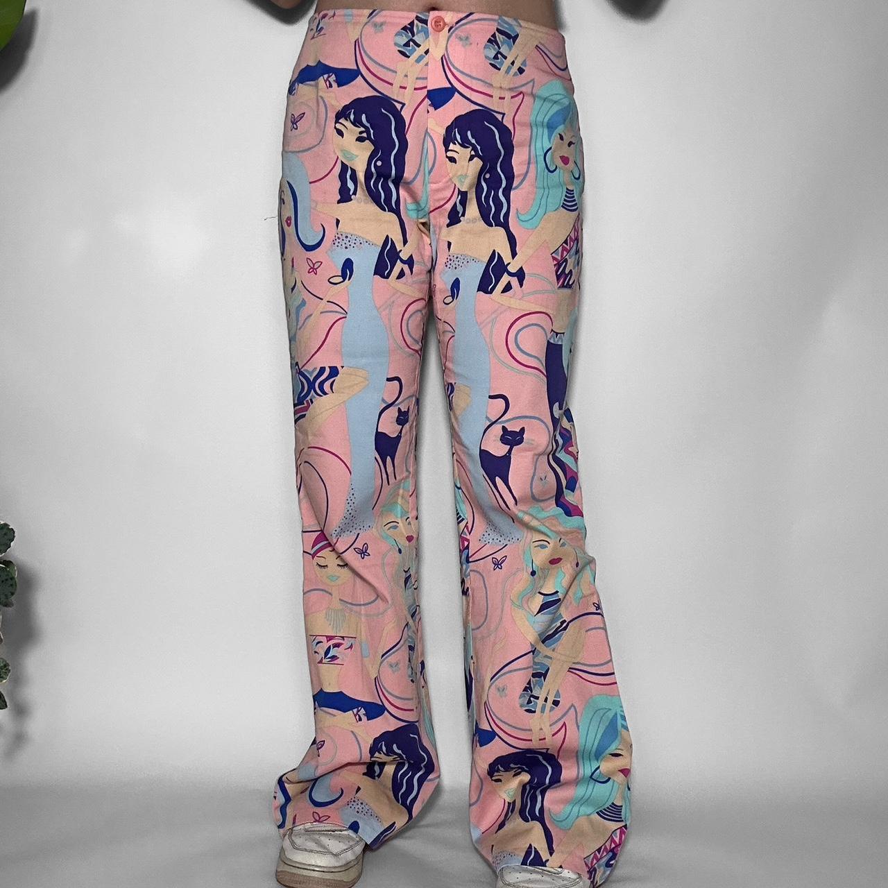 Vintage y2k multicoloured flared jeans with a cartoon woman print