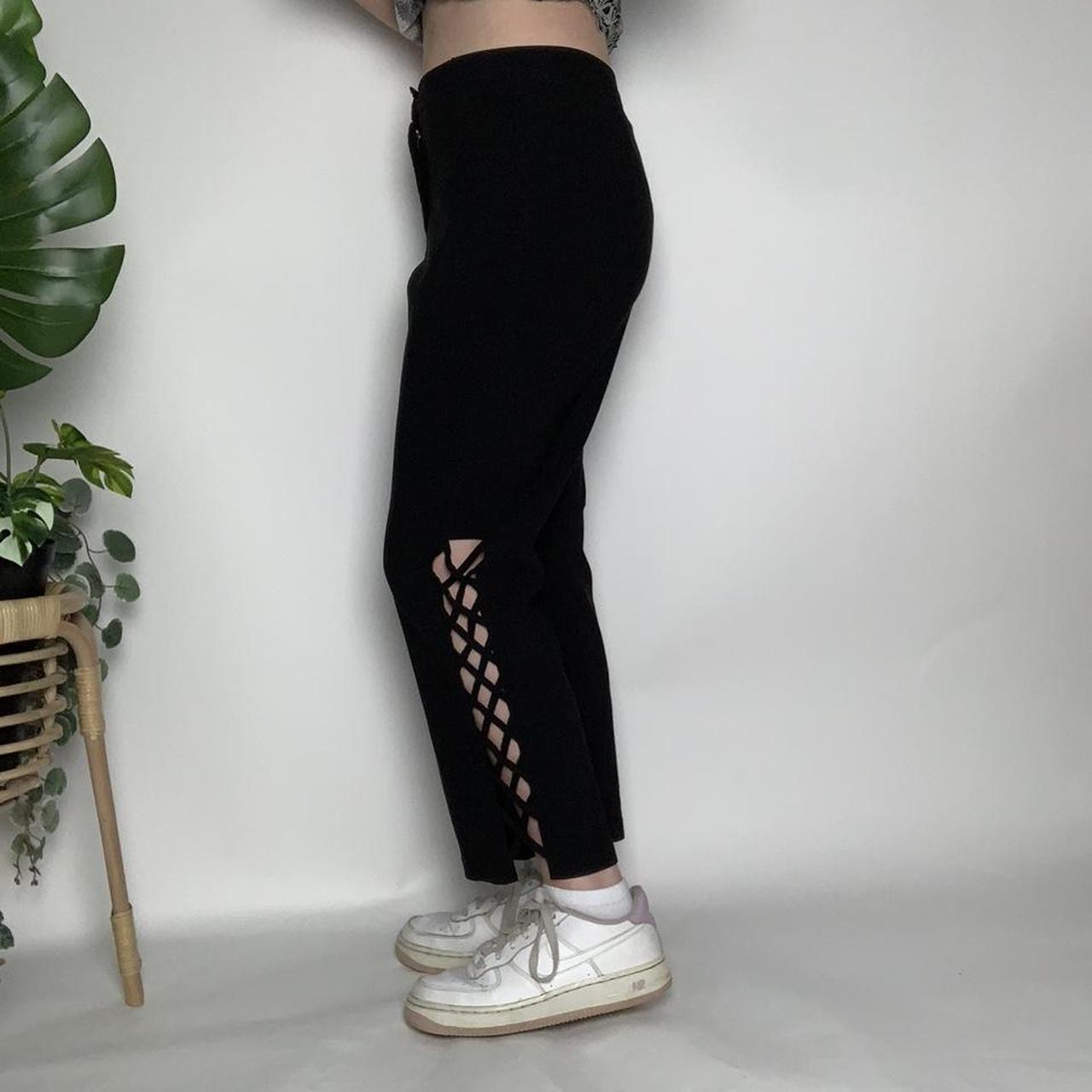 Vintage 90s black flared trousers with crisscross cut-out detailing