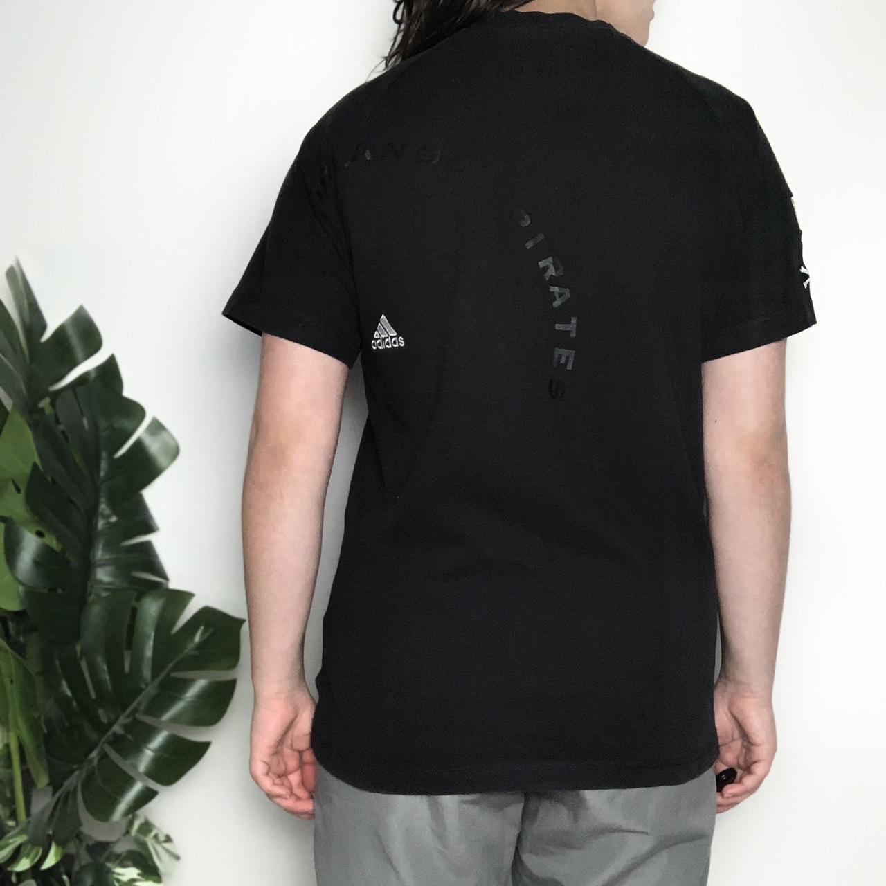 Vintage Y2K Adidas black graphic T-shirt with pirate skull and crossbones
