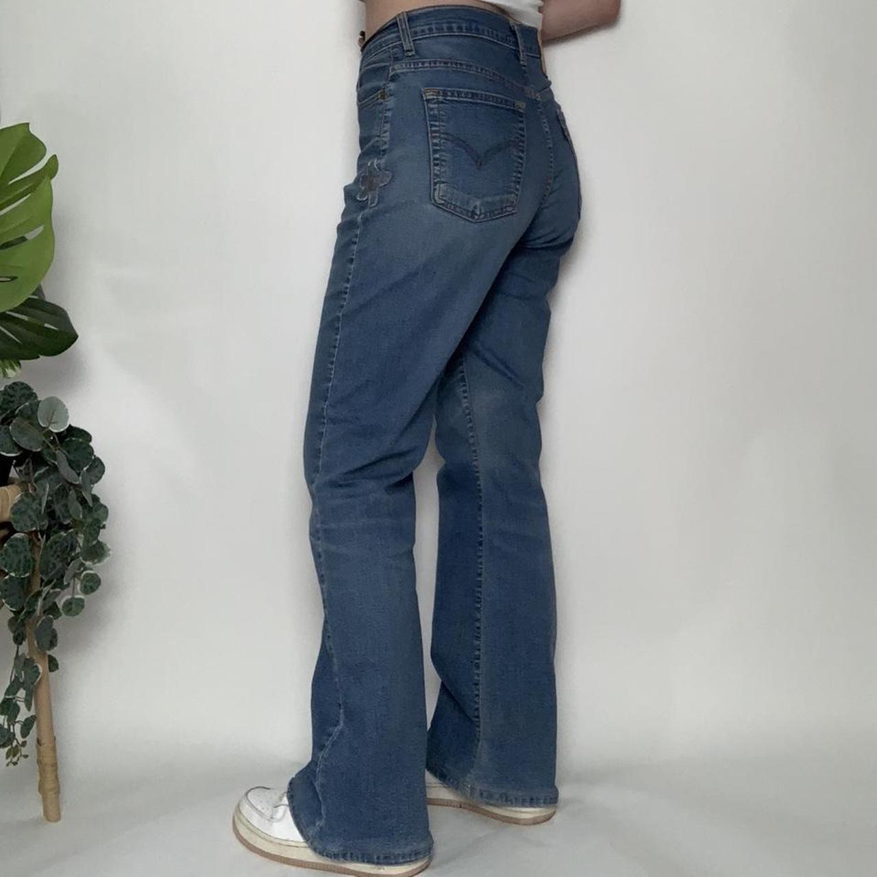 90s vintage bootcut midwash Levi’s jeans with flower patchwork