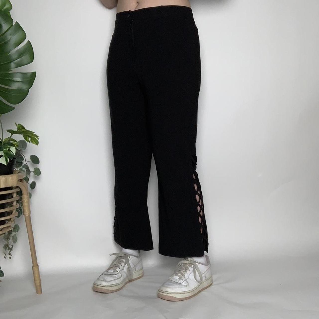 Vintage 90s black flared trousers with crisscross cut-out detailing